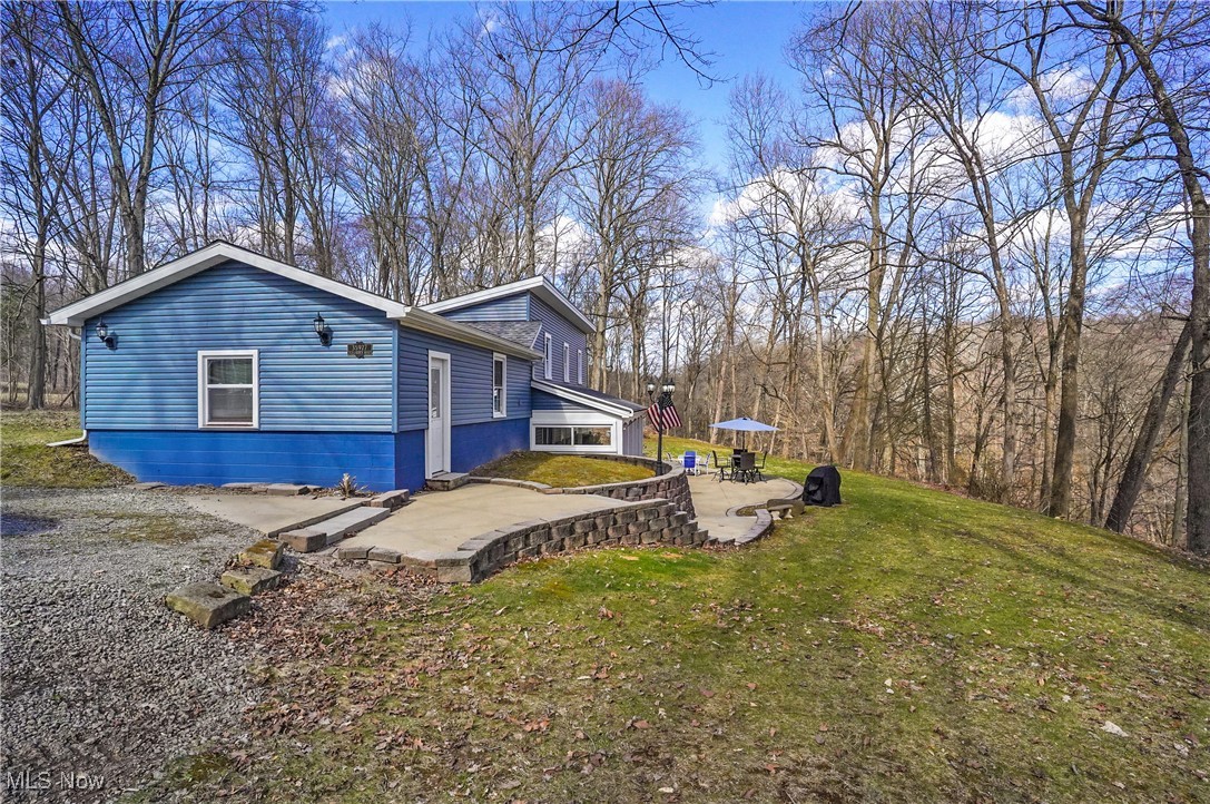35977 Teegarden Road Salem, OH 44460 - Photo 38 of 50 View of property exterior with a patio and a yard