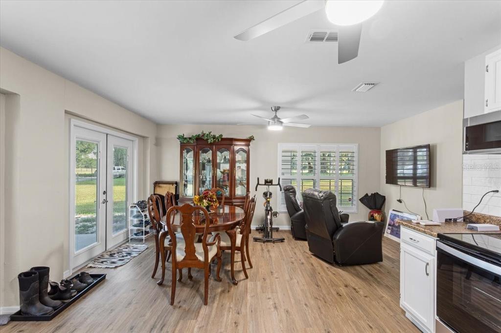 4700 Southwest Wilson Springs Road Fort White, FL 32038 - Photo 11 of 41 a living room with furniture a large window and wooden floor
