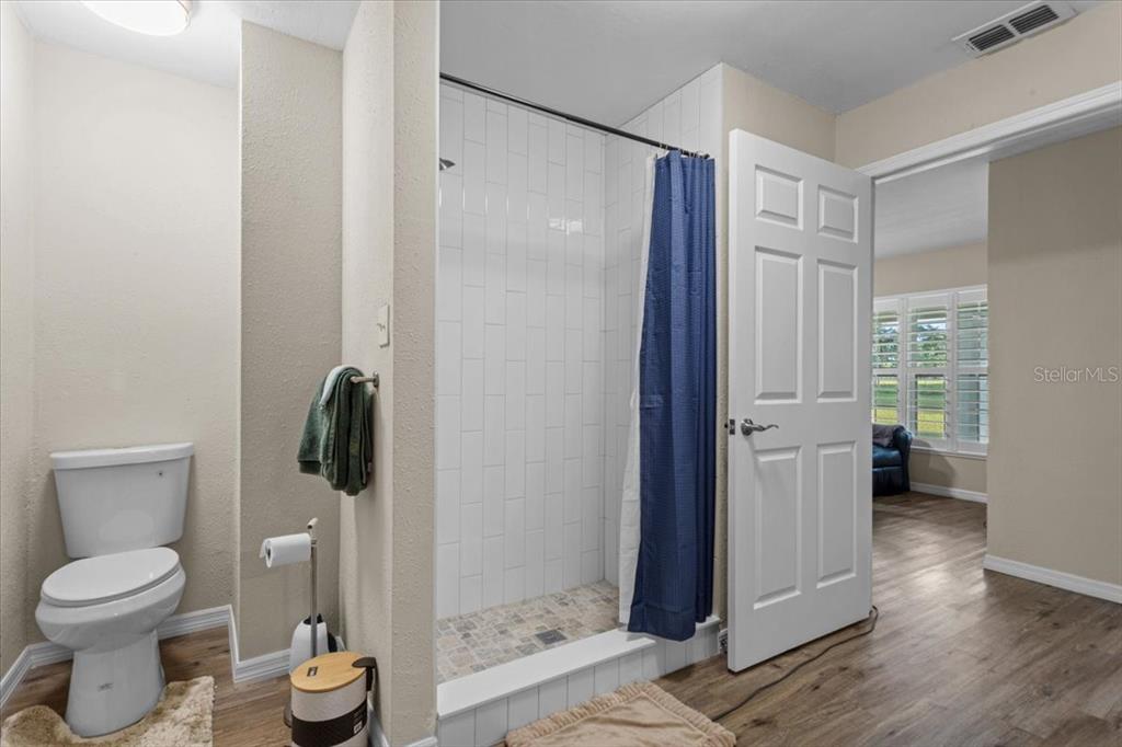 4700 Southwest Wilson Springs Road Fort White, FL 32038 - Photo 14 of 41 a bathroom with a toilet and a shower