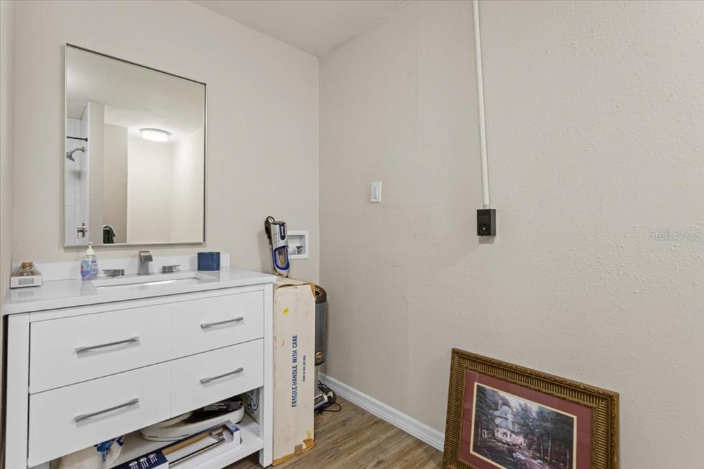 4700 Southwest Wilson Springs Road Fort White, FL 32038 - Photo 15 of 41 a bathroom with a sink a vanity and a mirror
