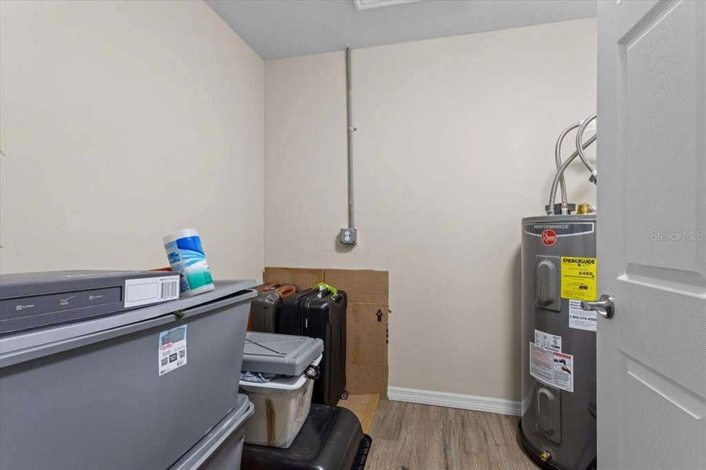 4700 Southwest Wilson Springs Road Fort White, FL 32038 - Photo 16 of 41 a room with a wooden floor and a sink