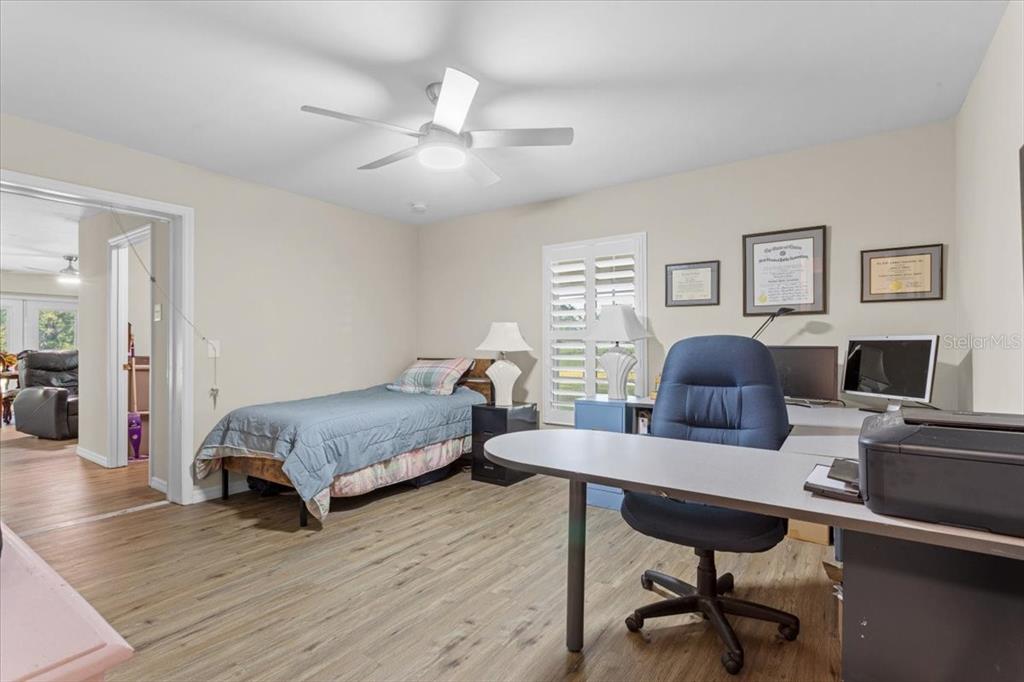 4700 Southwest Wilson Springs Road Fort White, FL 32038 - Photo 18 of 41 a living room with furniture and a wooden floor