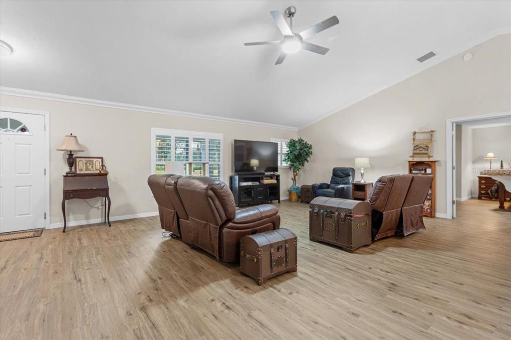 4700 Southwest Wilson Springs Road Fort White, FL 32038 - Photo 28 of 41 a living room with furniture and a flat screen tv