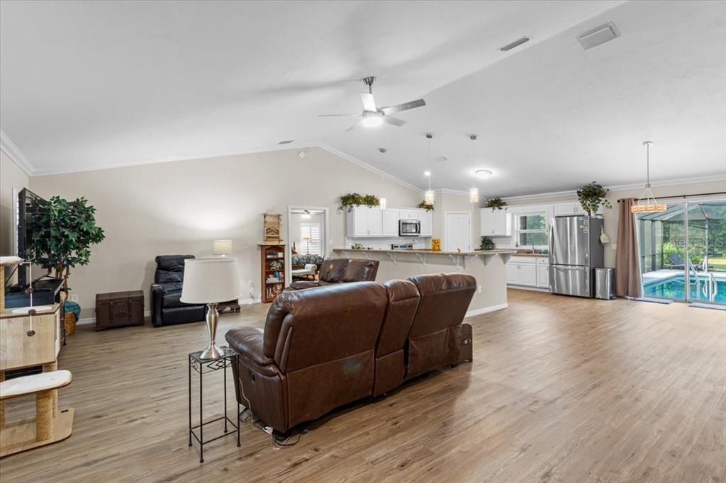 4700 Southwest Wilson Springs Road Fort White, FL 32038 - Photo 29 of 41 a living room with furniture and a wooden floor