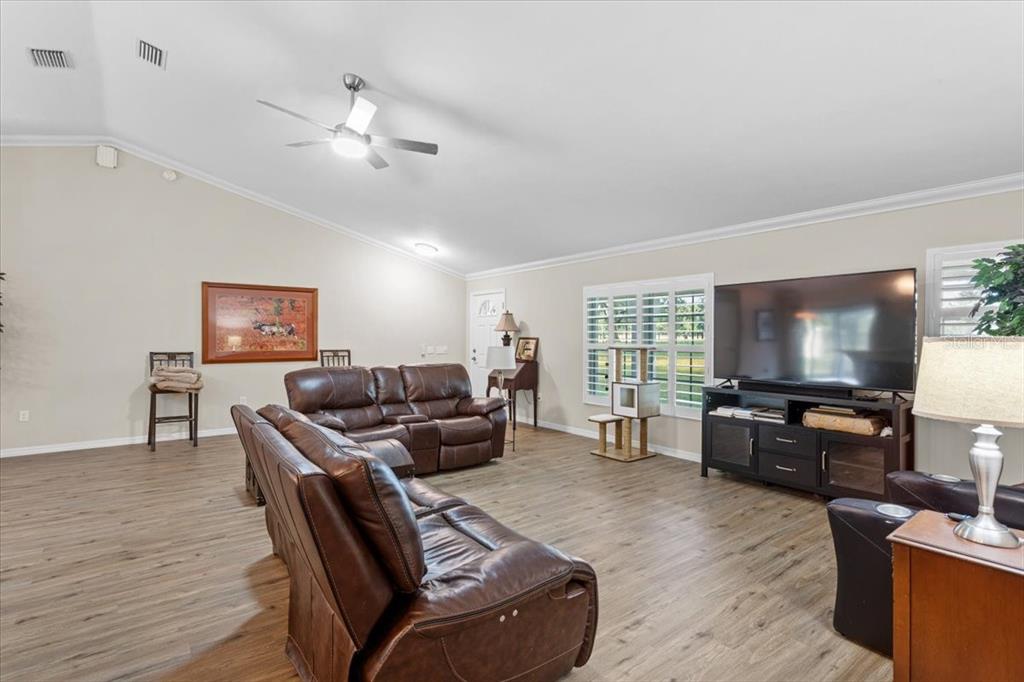 4700 Southwest Wilson Springs Road Fort White, FL 32038 - Photo 30 of 41 a living room with furniture and a flat screen tv