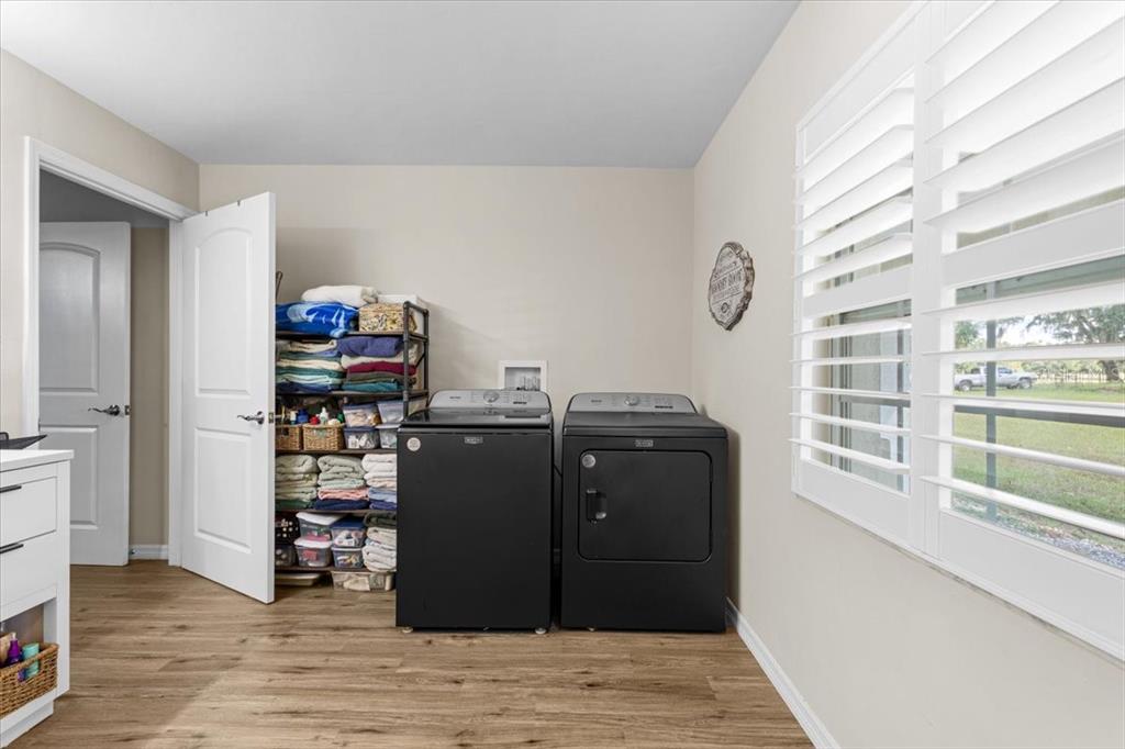4700 Southwest Wilson Springs Road Fort White, FL 32038 - Photo 38 of 41 a view of a living room with furniture and wooden floor