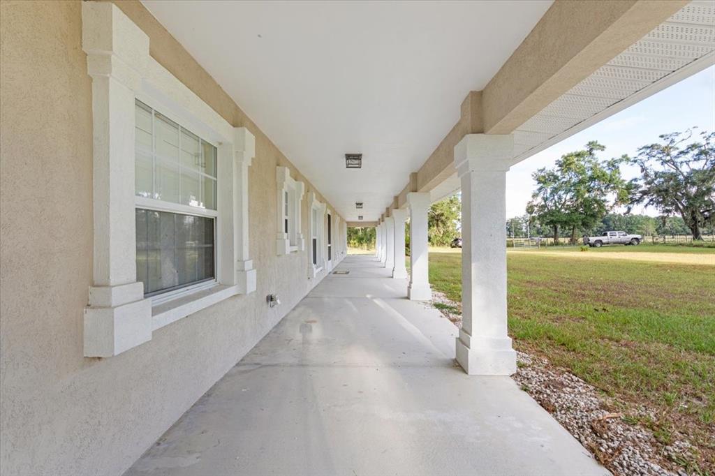 4700 Southwest Wilson Springs Road Fort White, FL 32038 - Photo 39 of 41 a view of a porch with furniture and garden