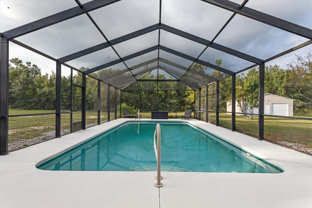 4700 Southwest Wilson Springs Road Fort White, FL 32038 - Photo 41 of 41 a swimming pool with a yard