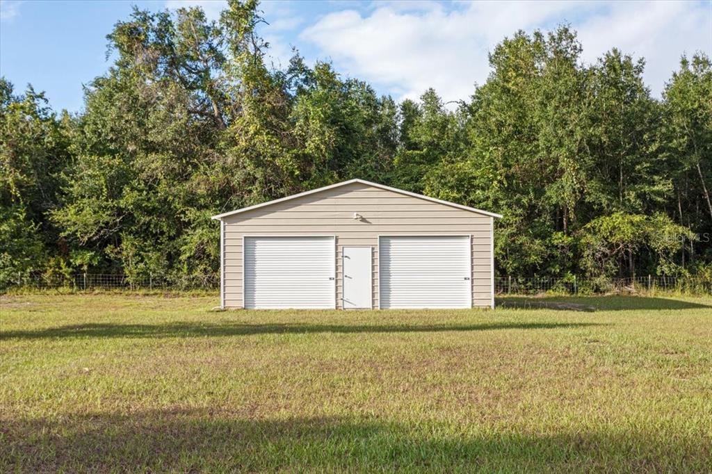 4700 Southwest Wilson Springs Road Fort White, FL 32038 - Photo 6 of 41 a front view of a house with a yard