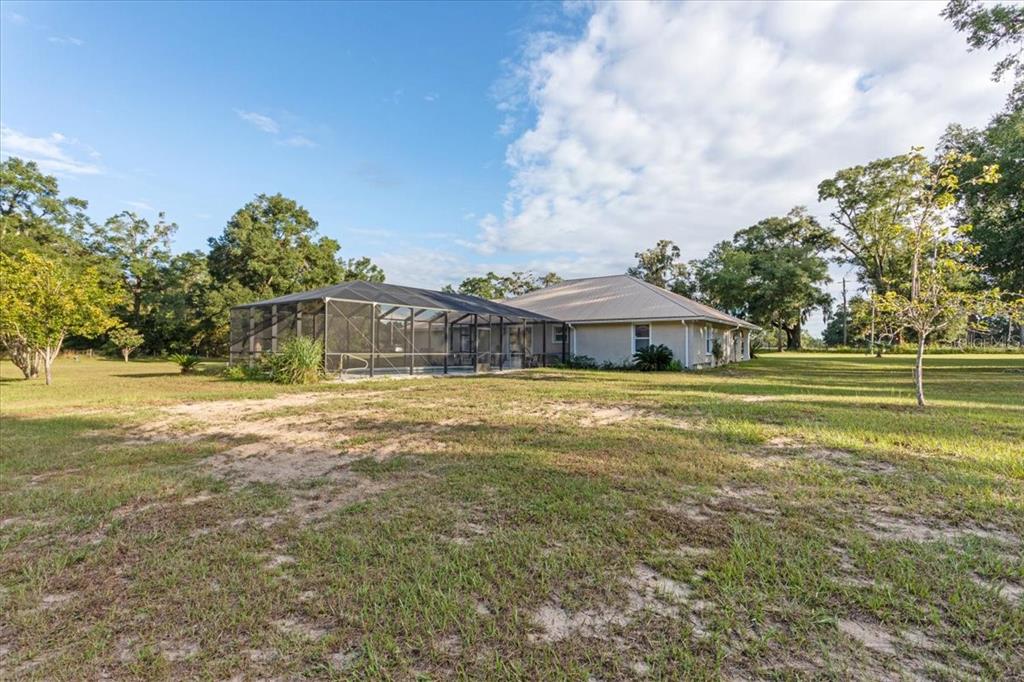4700 Southwest Wilson Springs Road Fort White, FL 32038 - Photo 7 of 41 a view of a house with a big yard