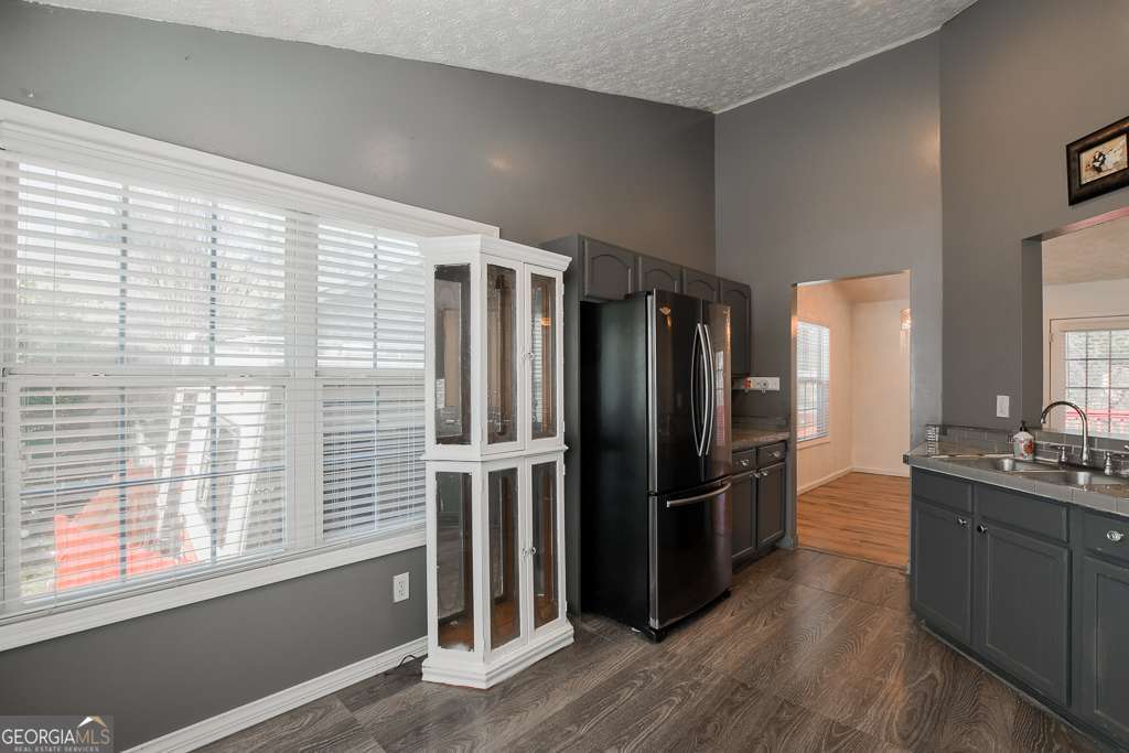 336 Shenandoah Circle Winder, GA 30680 - Photo 15 of 38 a kitchen with stainless steel appliances granite countertop a refrigerator and a sink