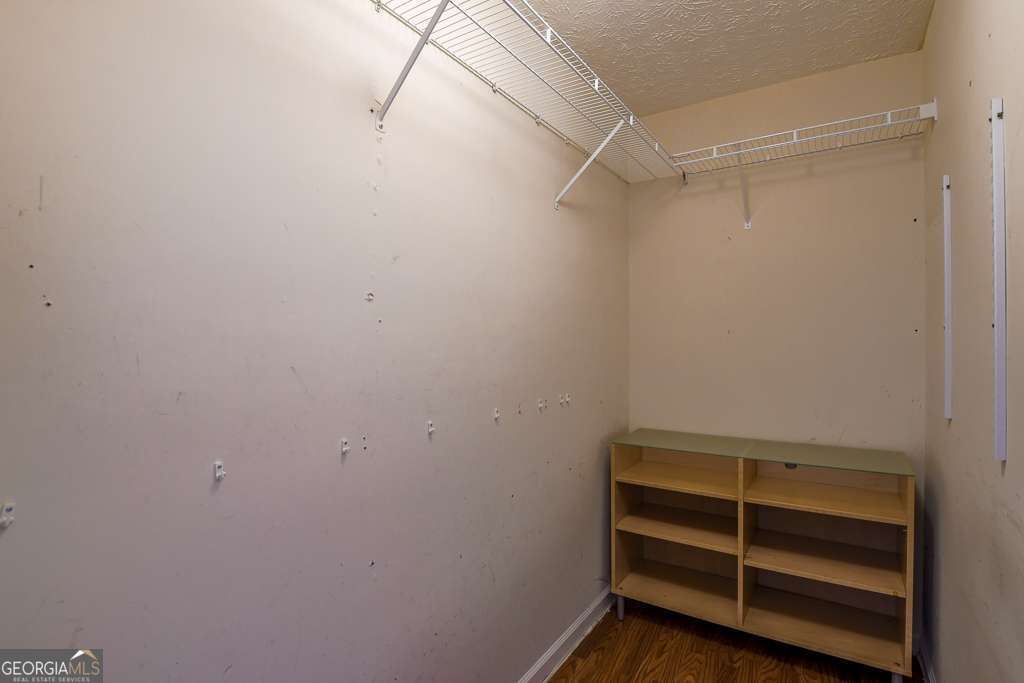 336 Shenandoah Circle Winder, GA 30680 - Photo 18 of 38 a view of walk in closet with empty racks