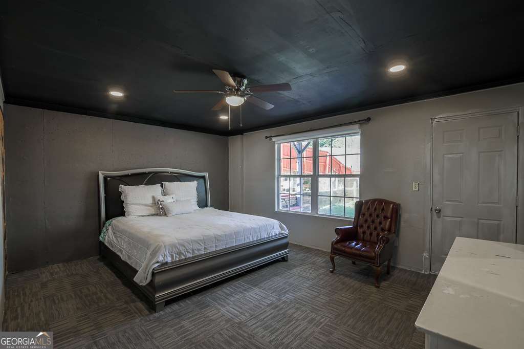 336 Shenandoah Circle Winder, GA 30680 - Photo 26 of 38 a bedroom with a bed chair and a window