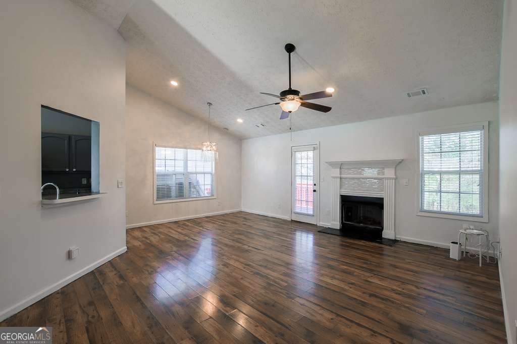 336 Shenandoah Circle Winder, GA 30680 - Photo 5 of 38 a view of empty room with wooden floor and fireplace