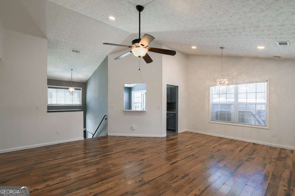 336 Shenandoah Circle Winder, GA 30680 - Photo 7 of 38 a view of an empty room with a window and wooden floor