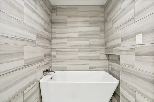 a bathroom with a white tub
