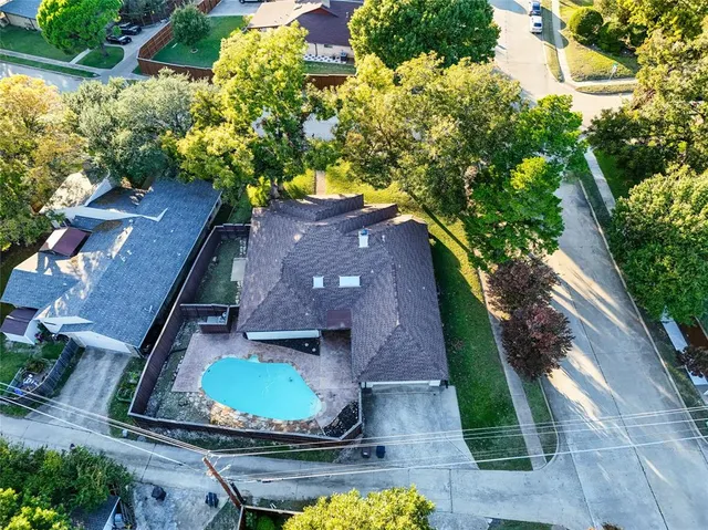 an aerial view of a house with a garden