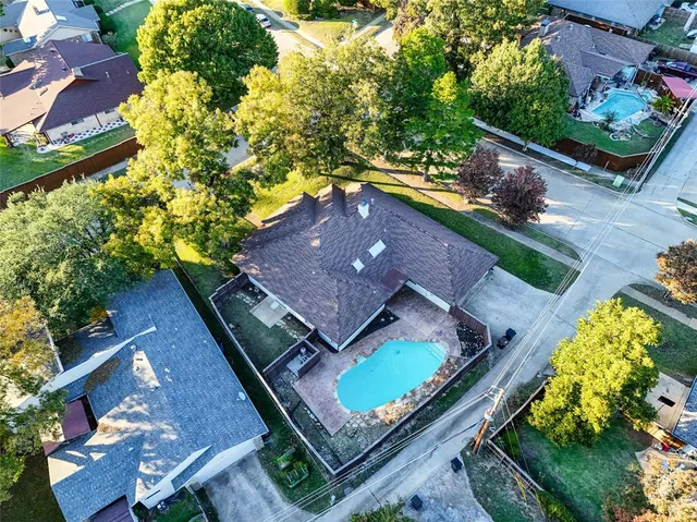 an aerial view of a house with a garden