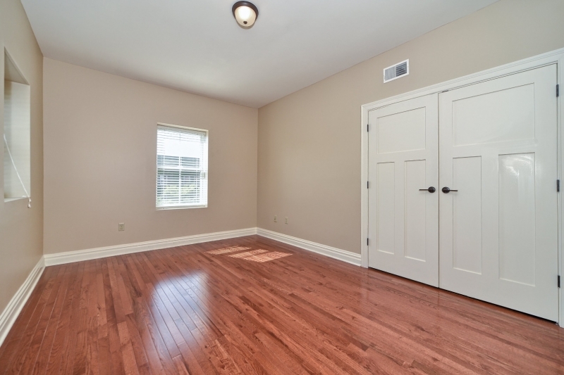 28 West Main Street, Unit 2D Somerville, NJ 08876 - Photo 4 of 13 an empty room with wooden floor and windows