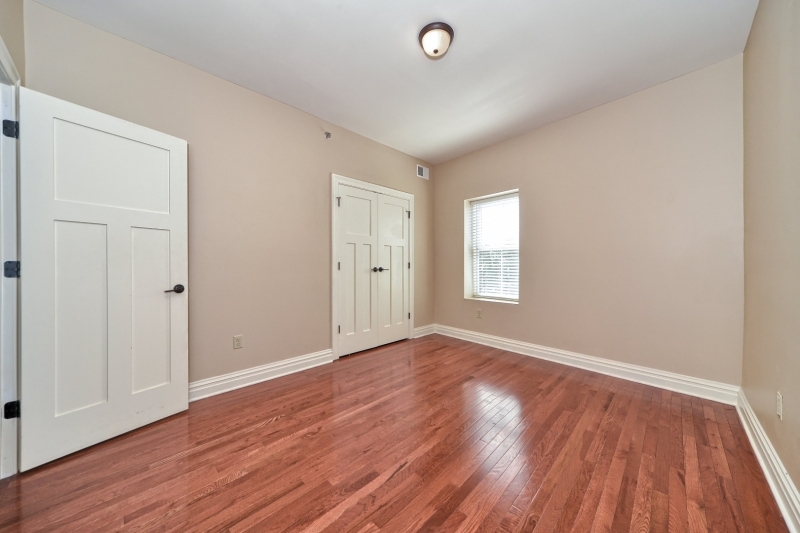 28 West Main Street, Unit 2D Somerville, NJ 08876 - Photo 5 of 13 a view of an empty room with wooden floor and a window