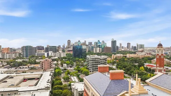 a view of a city with tall buildings