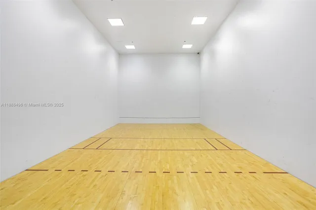 a room with lots of furniture a desk and chair