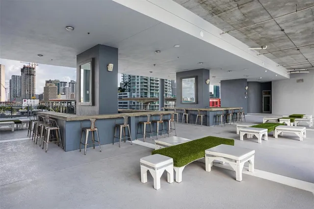 a view of a swimming pool with chairs