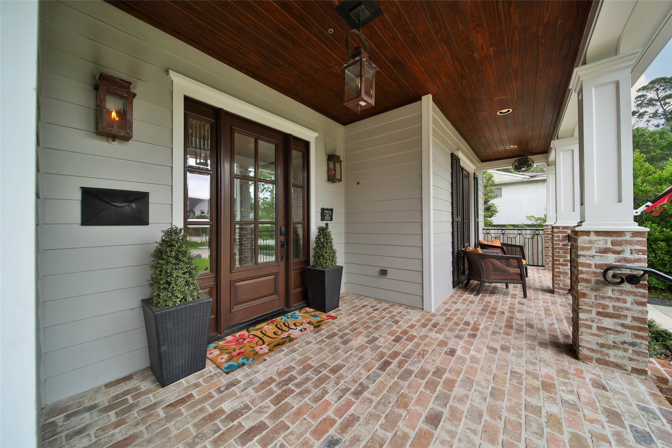 416 West 33rd Street Houston, TX 77018 - Photo 4 of 47 Warm wood-paneled ceilings, rich brick flooring, detailed masonry, and a striking glass-paneled front door create a stunning first impression the moment you arrive. This inviting front porch offers the perfect place to relax, greet neighbors, and enjoy the charm and close-knit community feel Garden Oaks is known for.