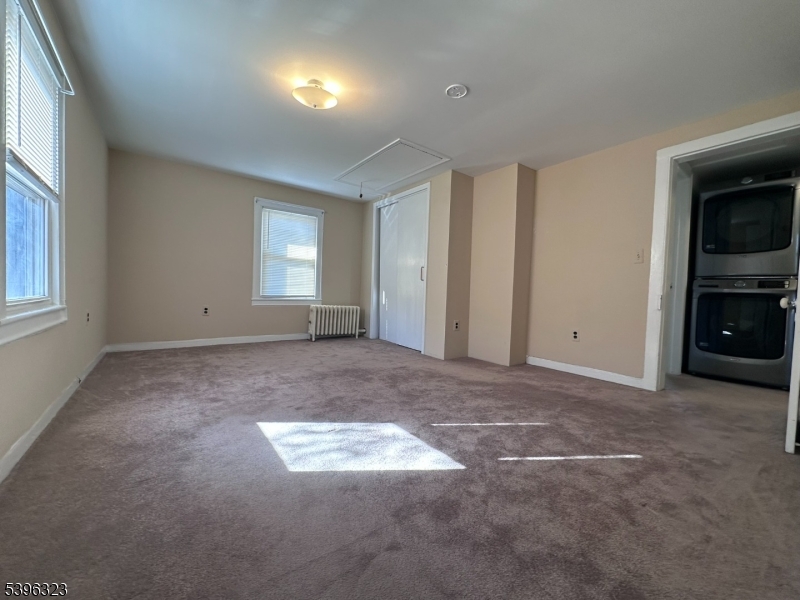 376 South Main Street, Unit 1 Wharton, NJ 07885 - Photo 7 of 14 an empty room with windows and fireplace