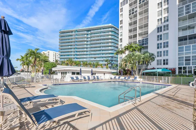 a view of a swimming pool with a patio