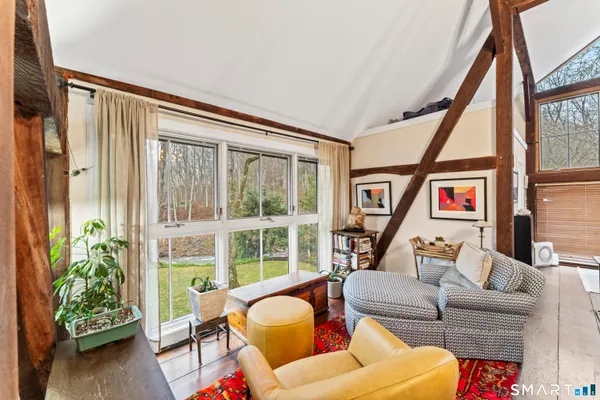 a bedroom with a bed and a potted plant