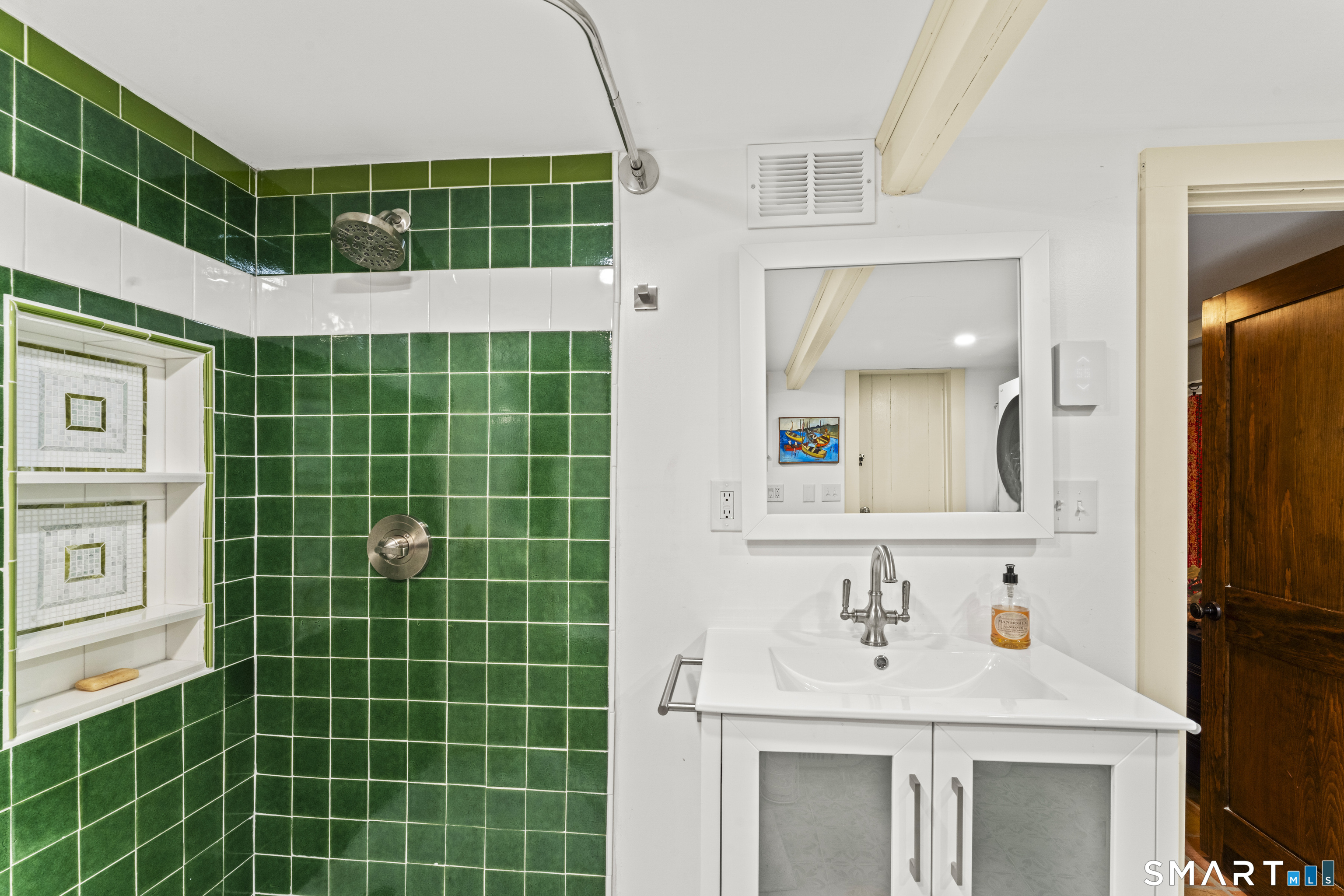 21 Old Mill Road New Milford, CT 06776 - Photo 28 of 43 The 3rd bath has a shower stall. The laundry is in this bathroom.