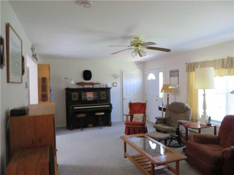 105 Robinhood Road Georgetown, ME 04548 - Photo 6 of 18 Living Room. Sunny windows!