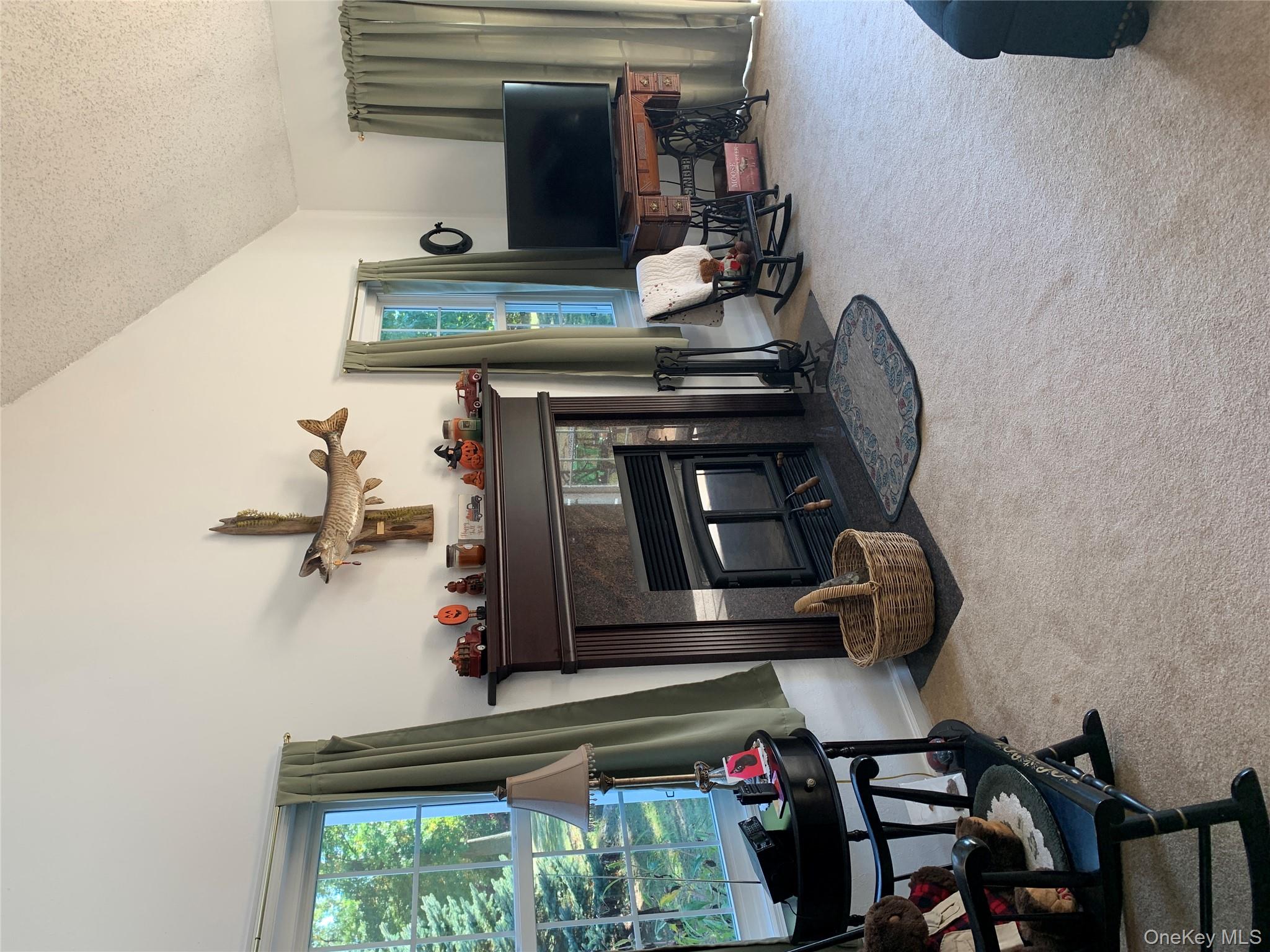 1 South Cambridge Court Fishkill, NY 12524 - Photo 14 of 49 a living room with furniture and a flat screen tv