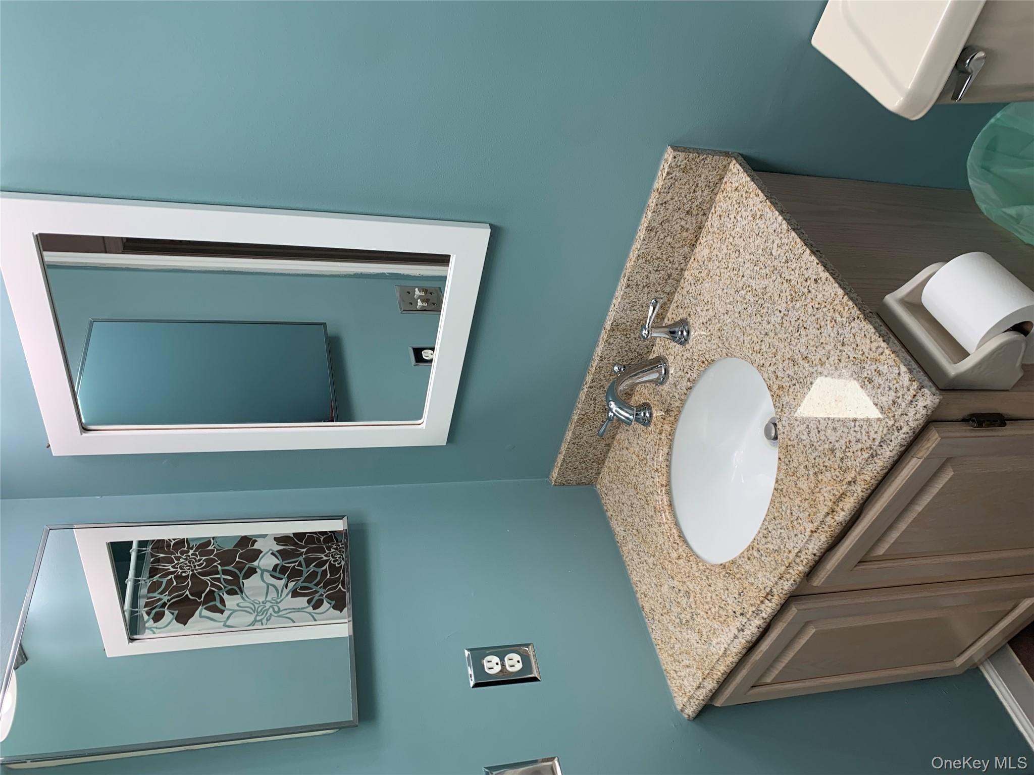 1 South Cambridge Court Fishkill, NY 12524 - Photo 20 of 49 a bathroom with a granite countertop sink and a mirror