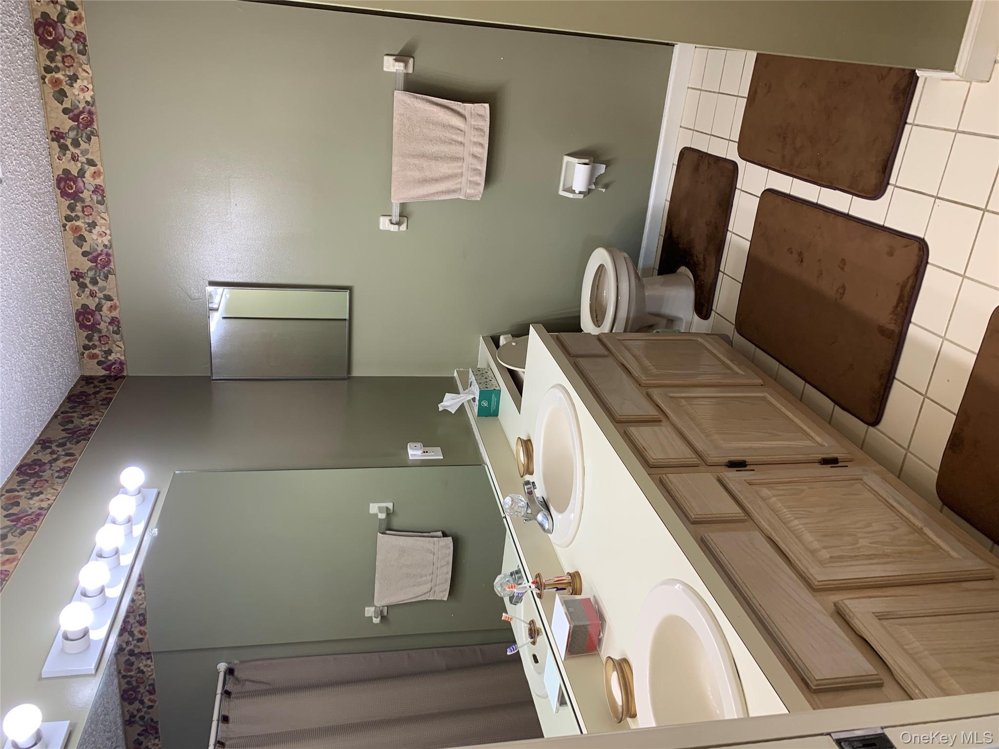 1 South Cambridge Court Fishkill, NY 12524 - Photo 27 of 49 a bathroom with a sink toilet and mirror