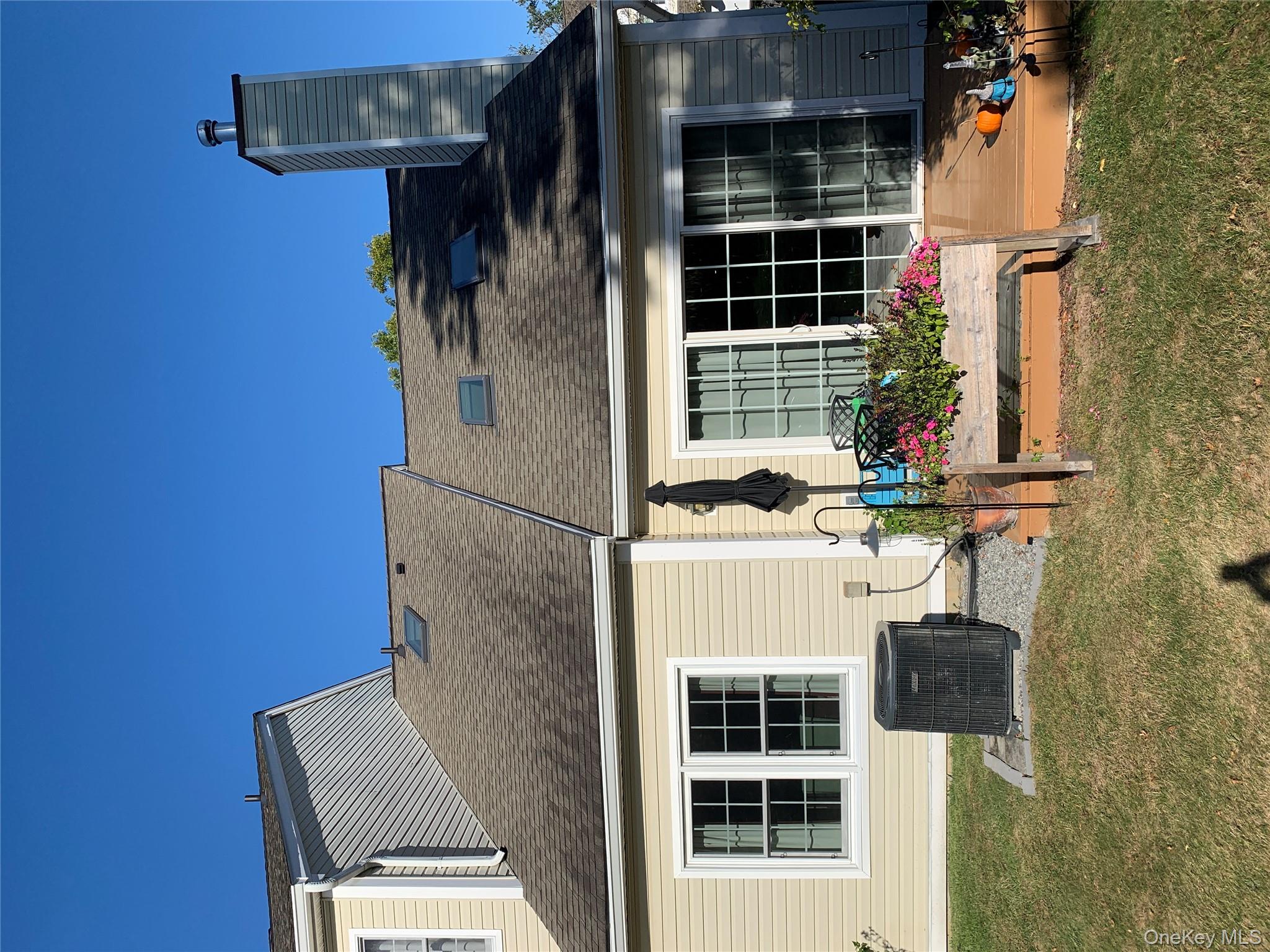 1 South Cambridge Court Fishkill, NY 12524 - Photo 40 of 49 a front view of a house with a yard