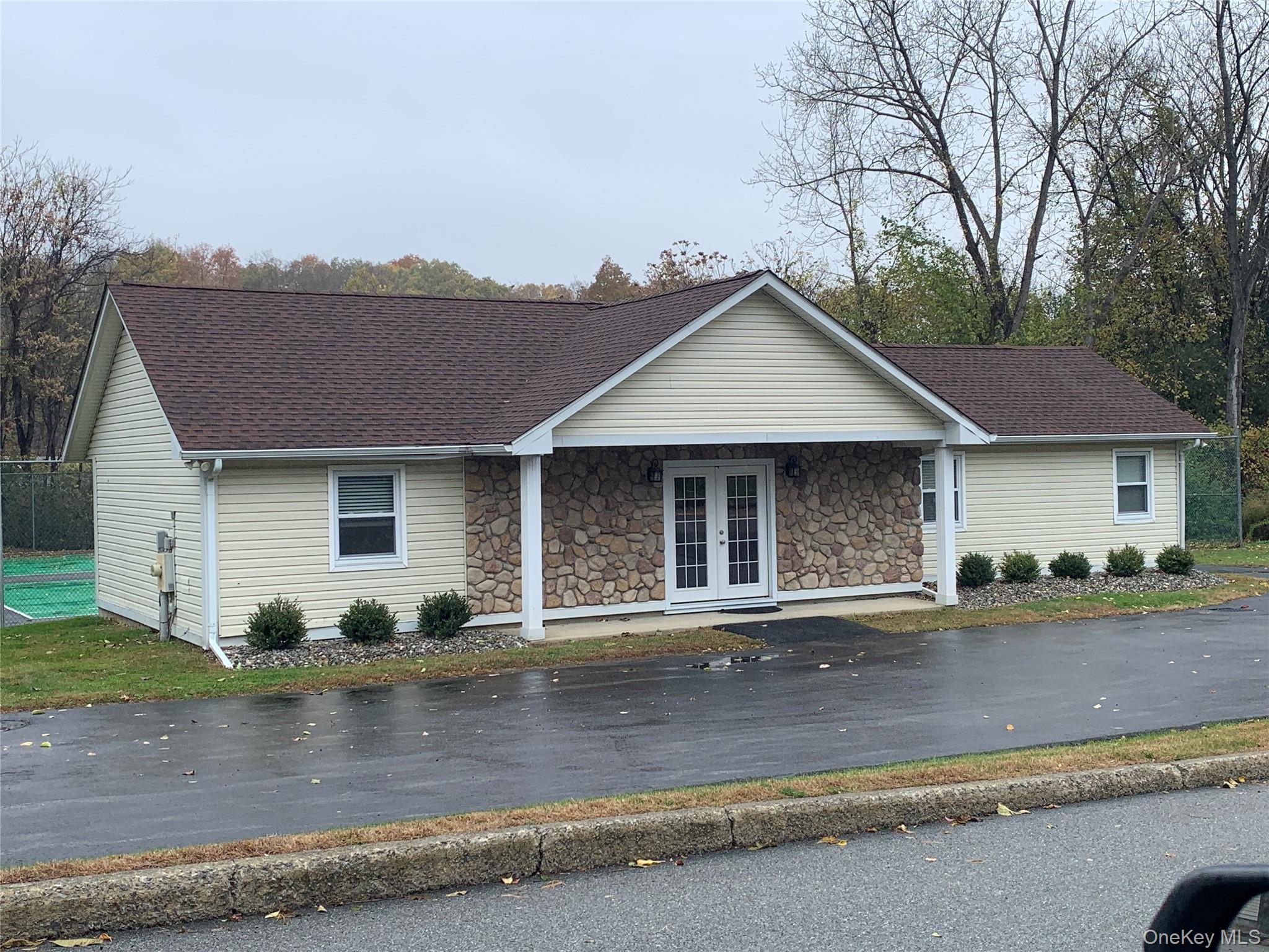 1 South Cambridge Court Fishkill, NY 12524 - Photo 43 of 49 a front view of a house with a yard