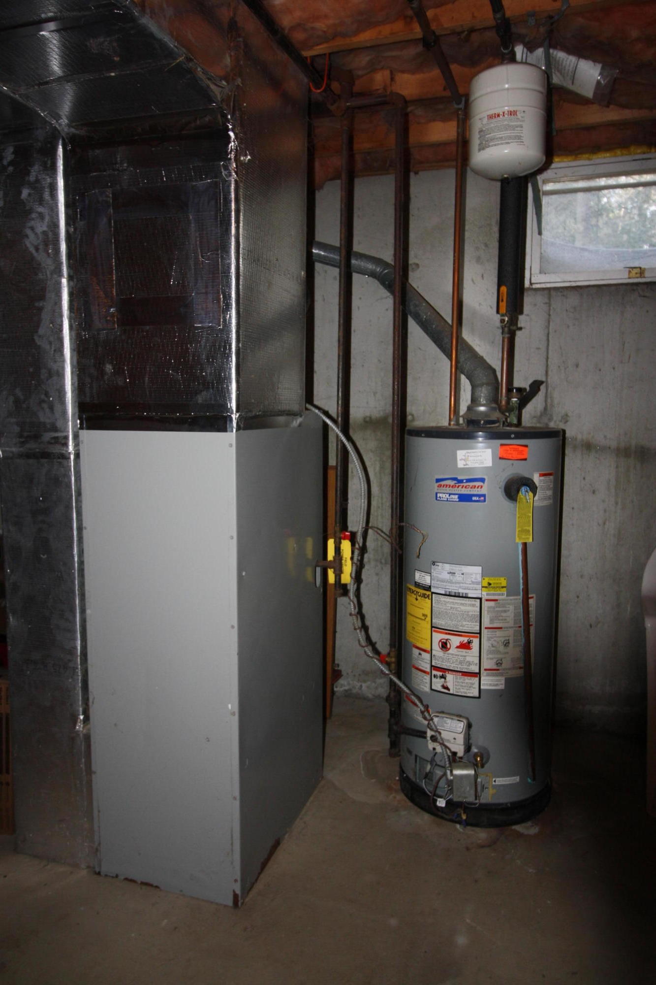 206 Nye Road Centerville, MA 02632 - Photo 11 of 14 a room with water heater and wooden racks