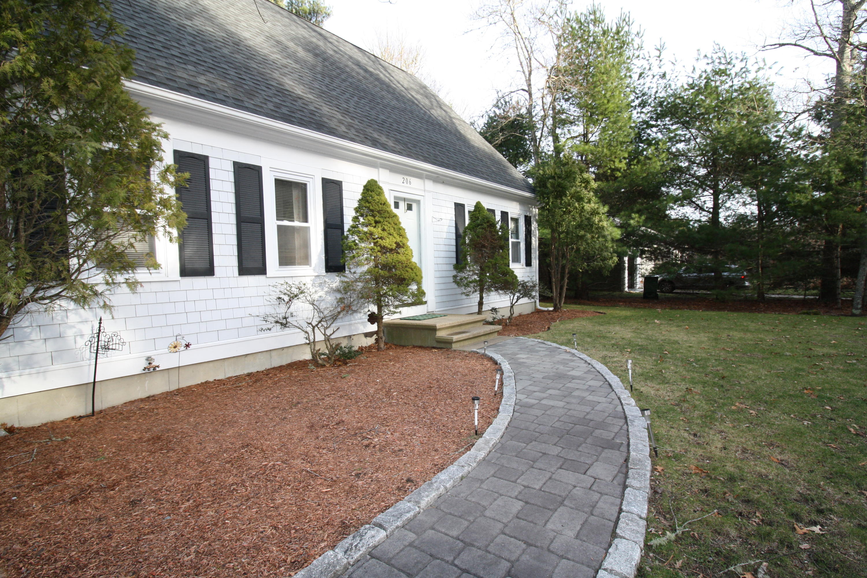 206 Nye Road Centerville, MA 02632 - Photo 14 of 14 a view of a house with backyard and sitting area