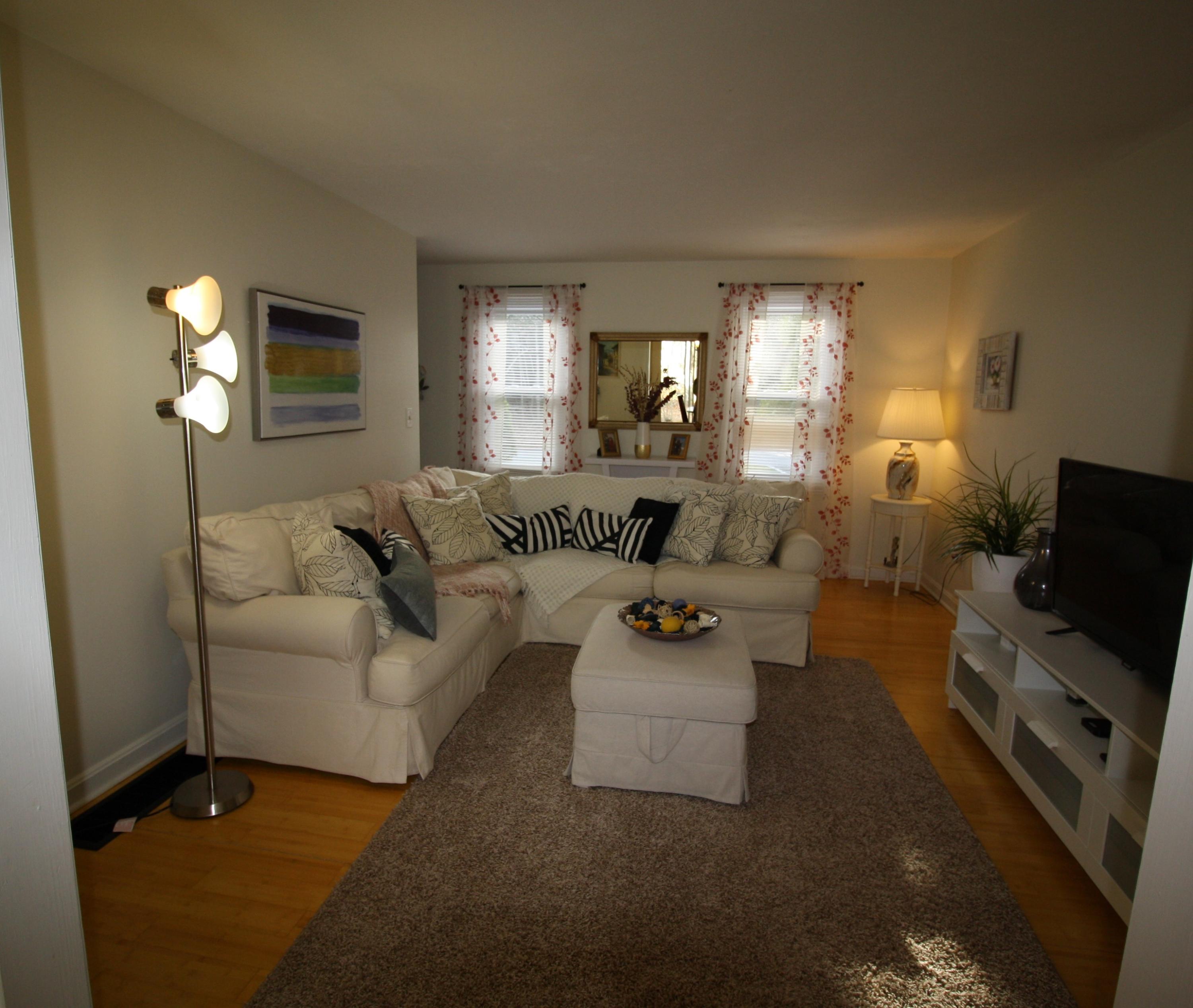 206 Nye Road Centerville, MA 02632 - Photo 4 of 14 a living room with furniture a fireplace and a flat screen tv