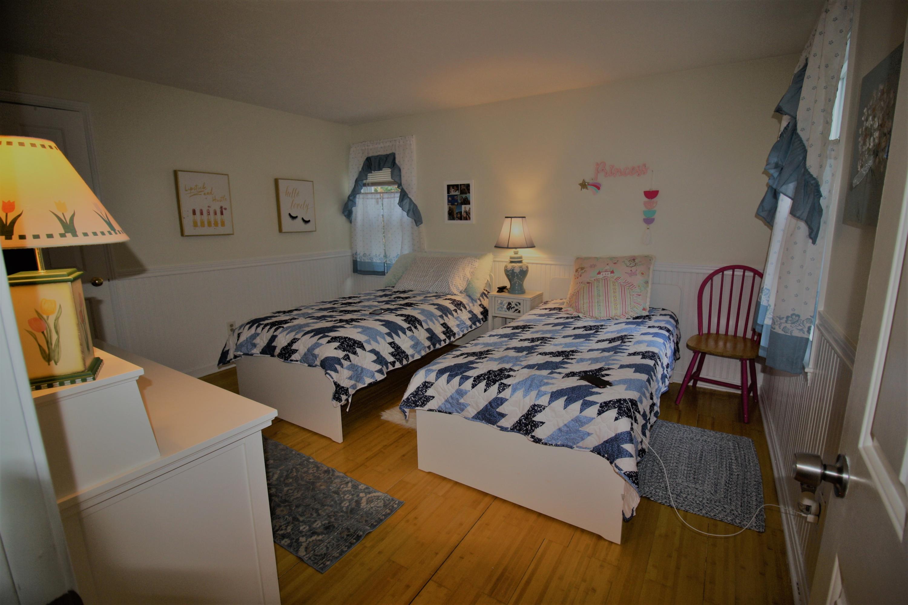 206 Nye Road Centerville, MA 02632 - Photo 7 of 14 a living room with furniture and a baby crib