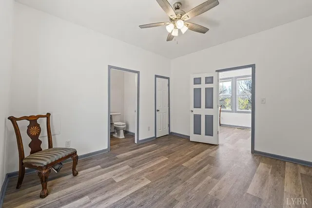 an empty room with windows and closet