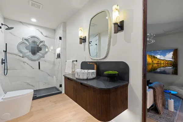 a living room with furniture and a fireplace