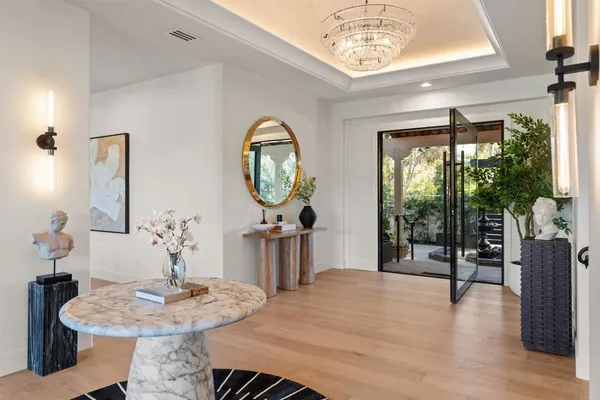 a kitchen with stainless steel appliances white cabinets and a granite counter tops