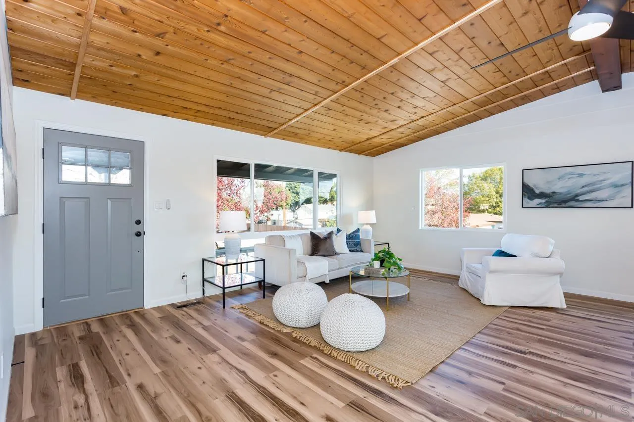 2610 Glebe Road Lemon Grove, CA 91945 - Photo 1 of 31 a view of a dining room with furniture a rug and wooden floor