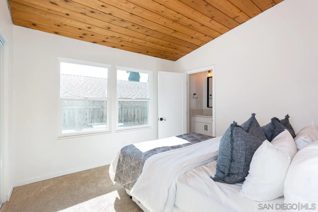 2610 Glebe Road Lemon Grove, CA 91945 - Photo 14 of 31 a bedroom with a bed and a window