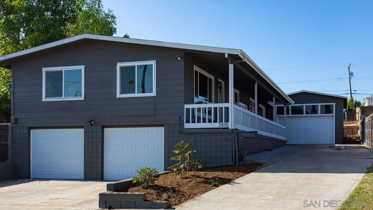 2610 Glebe Road Lemon Grove, CA 91945 - Photo 20 of 31 a front view of a house with balcony
