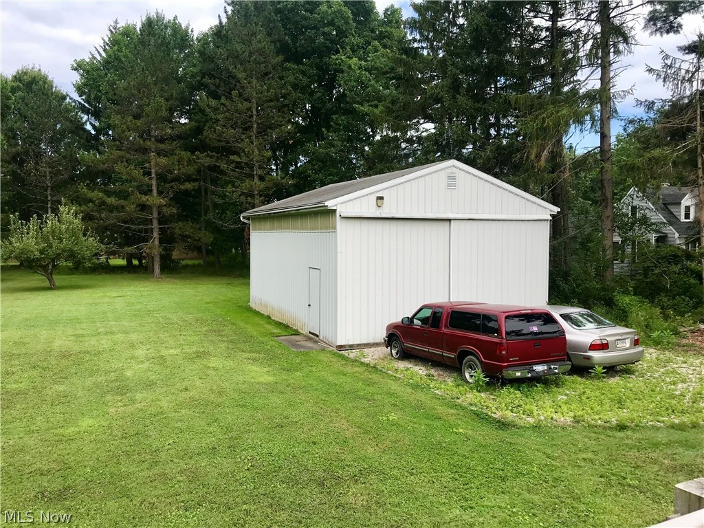 9111 Shepard Road Macedonia, OH 44056 - Photo 5 of 21 Pole Barn offers an additional 768 sf of storage, and has electricity, and oversized sliding door - can accomodate tall RVs!