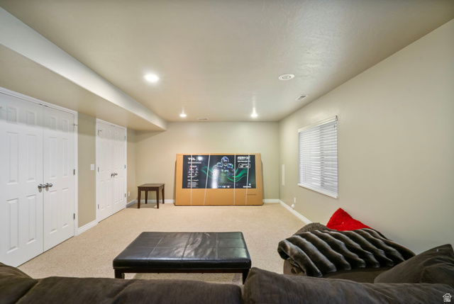 557 South 1470th Street East Springville, UT 84663 - Photo 26 of 46 Carpeted living room featuring baseboards and recessed lighting